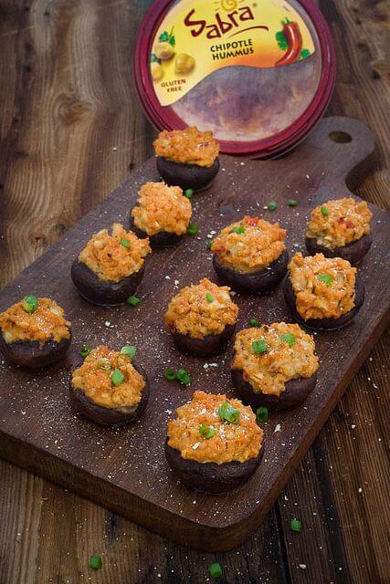 These healthy stuffed mushrooms are stuffed with hummus and are so easy to whip up with just the perfect amount of spicy! Great for game days and parties!