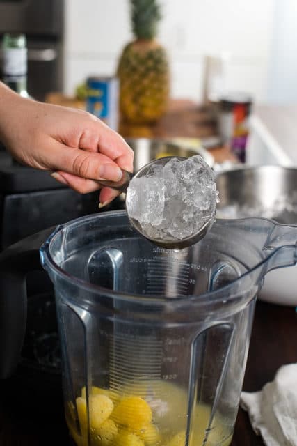 adding ice to the blender