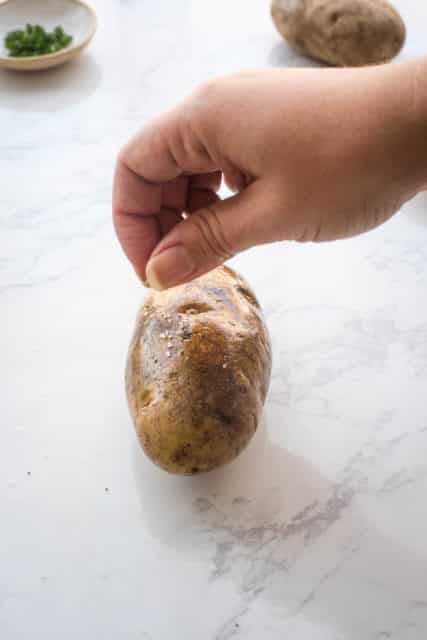 sprinkle baked potato skin with salt