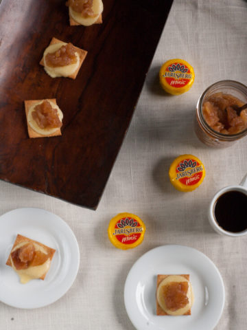 Apple Pie Cheese Bites: Cinnamon sugar pita chips are topped with melty Jarlsberg cheese and smothered with apple pie jam. The perfect last minute appetizer, snack or dessert to keep on hand or take to a party!
