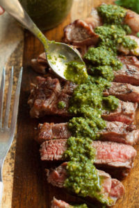 Chimichurri Sauce--A traditional Argentinian sauce served with barbecued meats. Perfect stirred into soups, spread on grilled cheese or tossed with pasta.